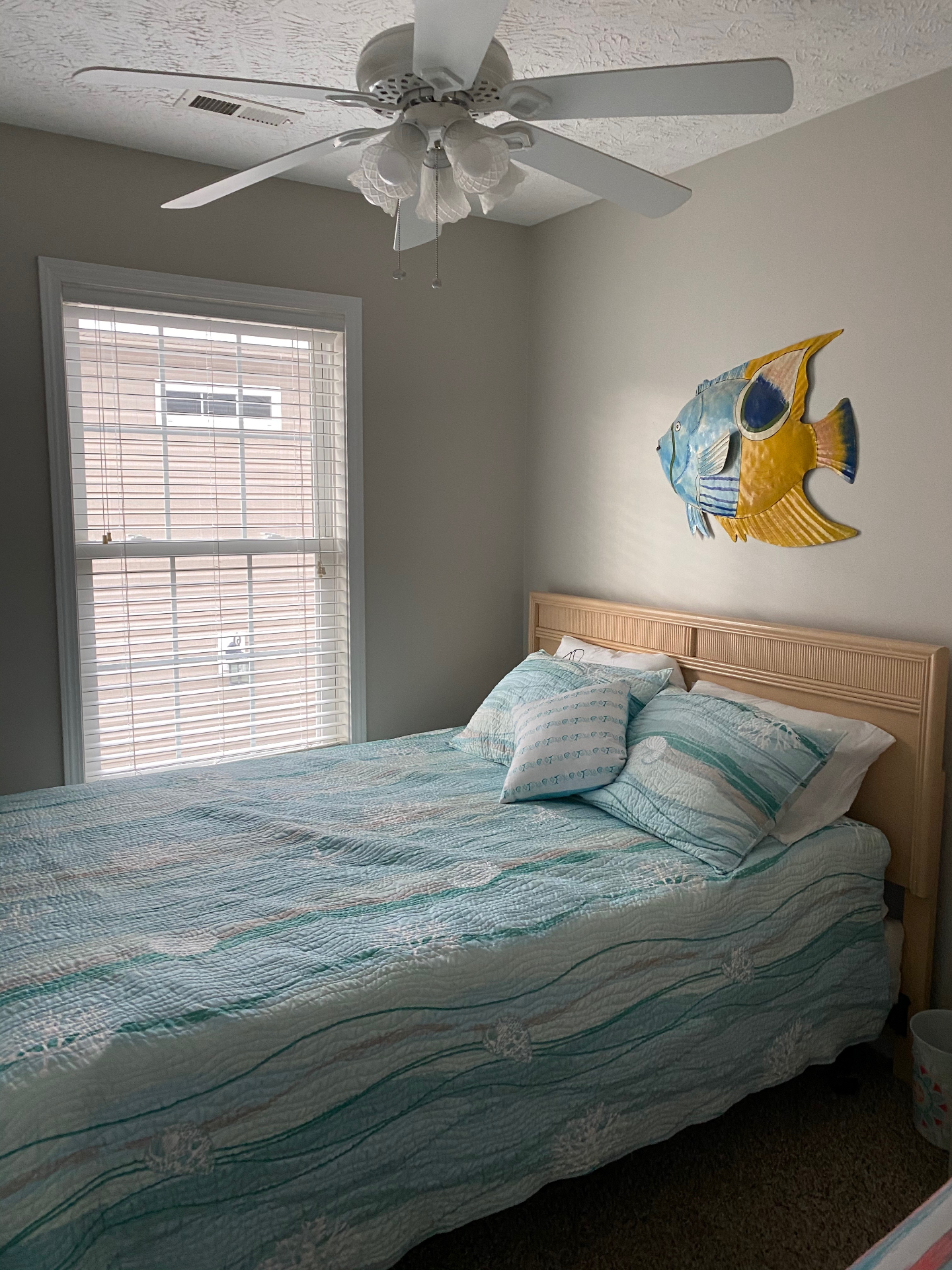 Queen bedroom with seaside quilt