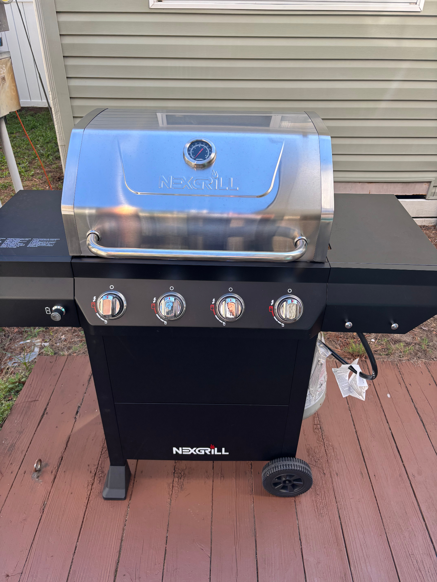 4-burner gas grill on the deck