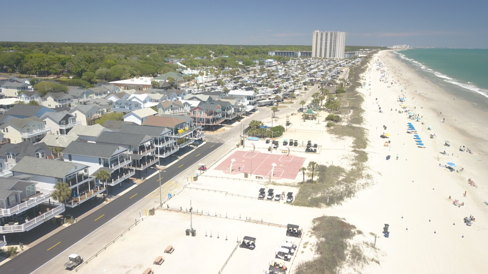 Beachfront basketball courts and golf cart paths